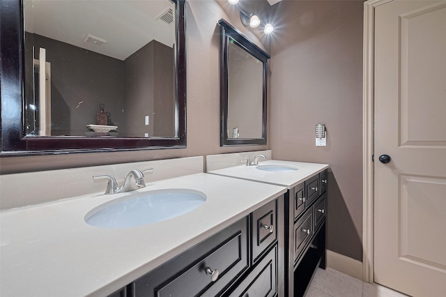 131 Breezy Shore Ct, Dickinson, TX 77539 - bathroom with a sink, tile patterned flooring, double vanity, and visible vents