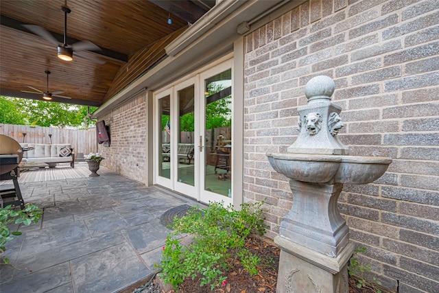 131 Breezy Shore Ct, Dickinson, TX 77539 - view of patio / terrace featuring ceiling fan, fence, and french doors