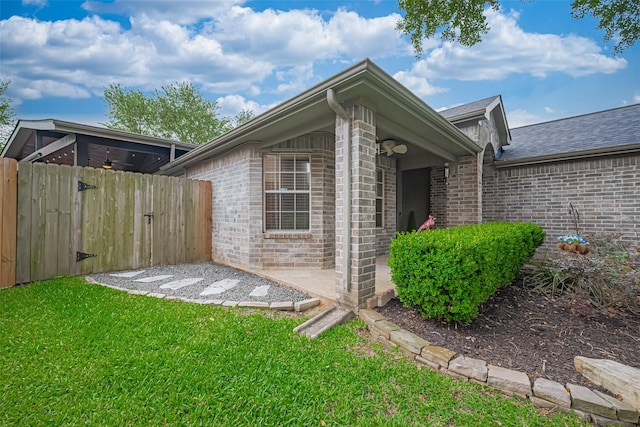131 Breezy Shore Ct, Dickinson, TX 77539 - exterior space with a lawn, brick siding, fence, and roof with shingles