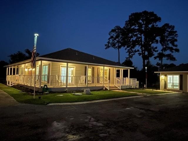 view of back of house at twilight