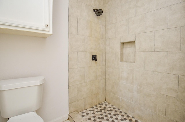 full bath with toilet and a tile shower