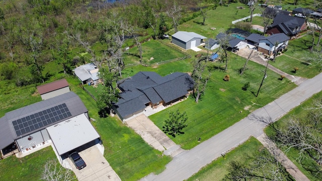 birds eye view of property with a residential view