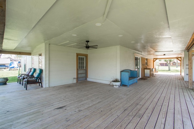 wooden deck featuring a ceiling fan