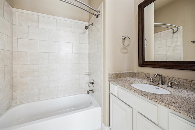 bathroom featuring vanity and tub / shower combination