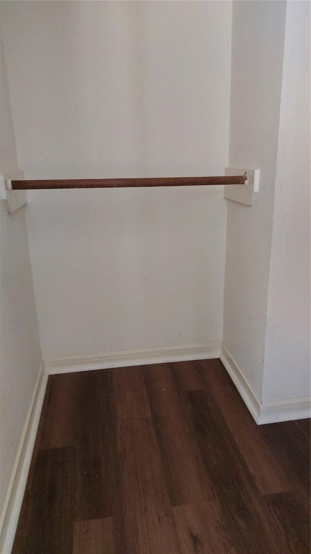 13411 Sarento Vlg, Sugar Land, TX 77498 - walk in closet with dark wood-type flooring