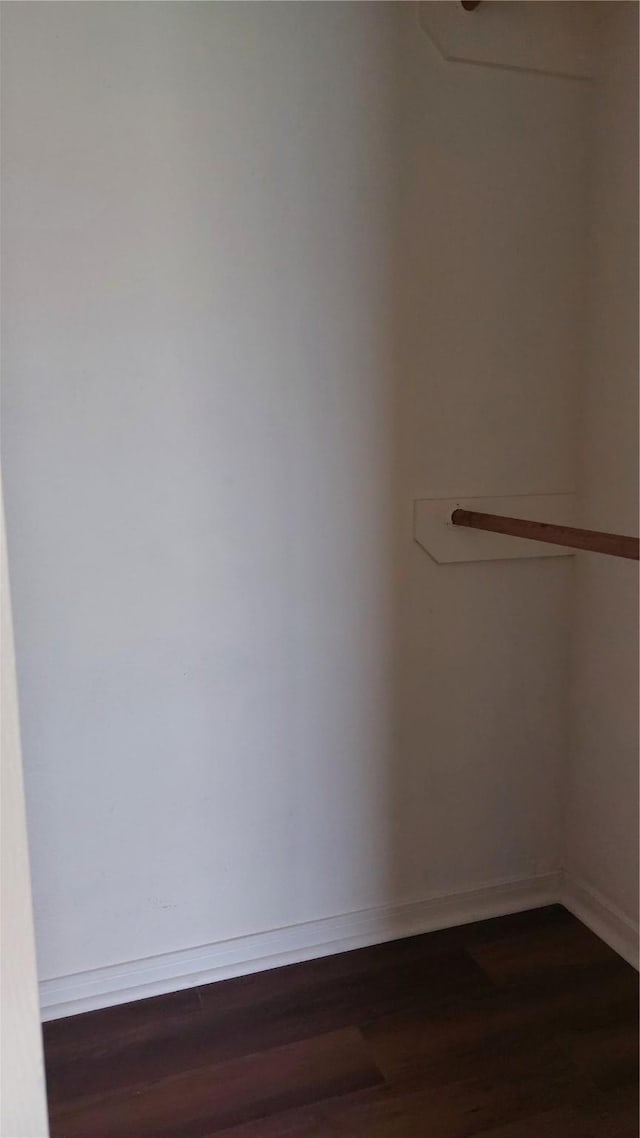 13411 Sarento Vlg, Sugar Land, TX 77498 - spacious closet featuring dark wood finished floors