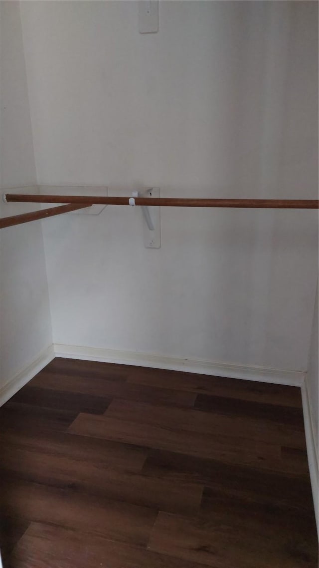 13411 Sarento Vlg, Sugar Land, TX 77498 - walk in closet featuring dark wood-style floors