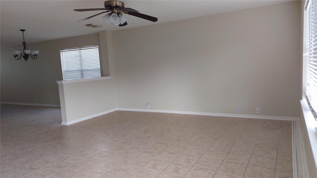 13411 Sarento Vlg, Sugar Land, TX 77498 - unfurnished room with baseboards, visible vents, ceiling fan with notable chandelier, and light tile patterned flooring