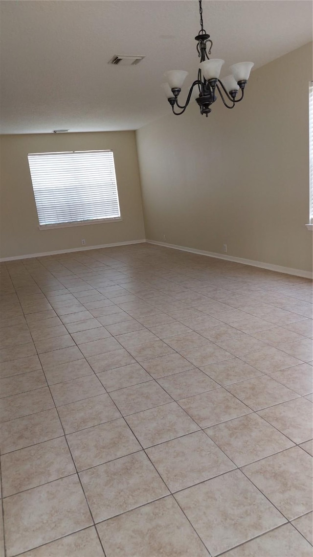 13411 Sarento Vlg, Sugar Land, TX 77498 - unfurnished room featuring a chandelier, visible vents, and baseboards
