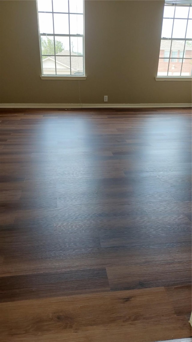 13411 Sarento Vlg, Sugar Land, TX 77498 - unfurnished room with dark wood-type flooring and baseboards