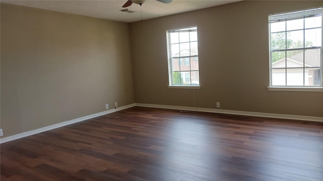 13411 Sarento Vlg, Sugar Land, TX 77498 - empty room featuring dark wood finished floors, baseboards, visible vents, and ceiling fan
