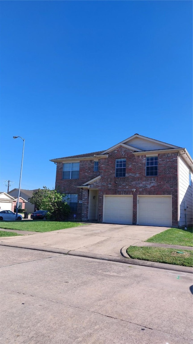 13411 Sarento Vlg, Sugar Land, TX 77498 - view of front of home with brick siding, driveway, and an attached garage