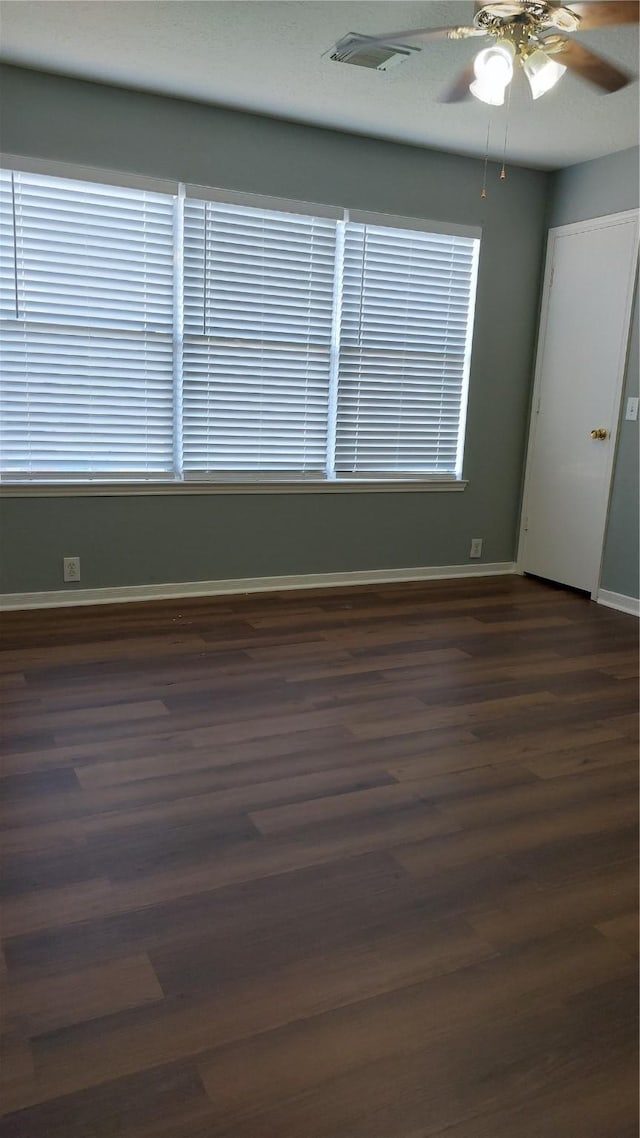 13411 Sarento Vlg, Sugar Land, TX 77498 - spare room with ceiling fan, dark wood finished floors, and baseboards