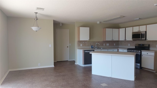 13411 Sarento Vlg, Sugar Land, TX 77498 - kitchen featuring visible vents, decorative light fixtures, light countertops, white cabinets, and appliances with stainless steel finishes