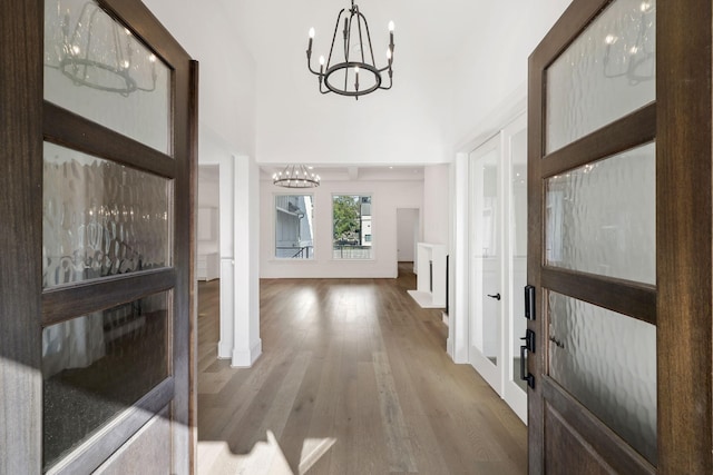 3714 Grennoch Ln, Houston, TX 77025 - entryway with a chandelier, wood finished floors, baseboards, and a towering ceiling