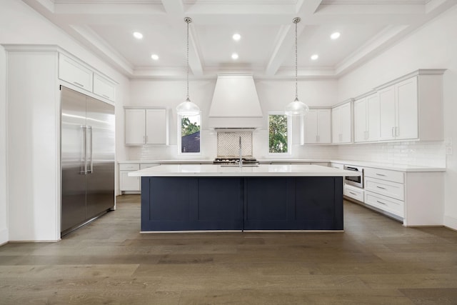 3714 Grennoch Ln, Houston, TX 77025 - kitchen with stainless steel built in fridge, coffered ceiling, premium range hood, backsplash, and a kitchen island with sink