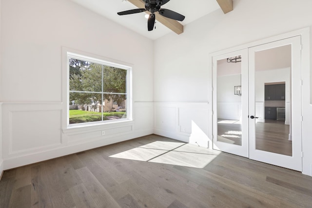 3714 Grennoch Ln, Houston, TX 77025 - unfurnished room with ceiling fan, a wainscoted wall, wood finished floors, french doors, and a decorative wall