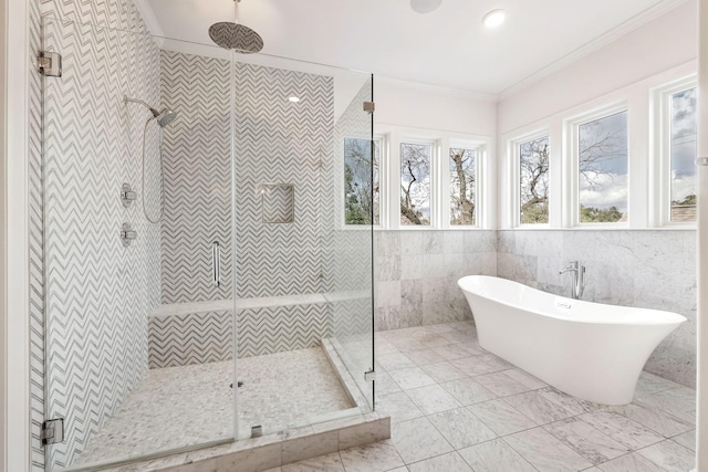 3714 Grennoch Ln, Houston, TX 77025 - full bath with a shower stall, a freestanding bath, crown molding, tile walls, and marble finish floors