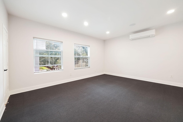 3714 Grennoch Ln, Houston, TX 77025 - empty room featuring a wall mounted air conditioner, recessed lighting, and dark colored carpet