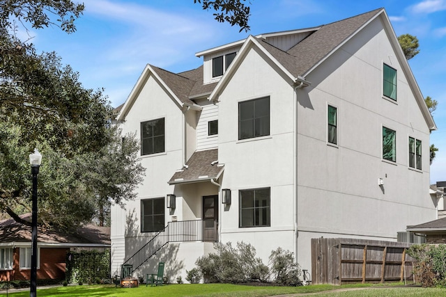 3714 Grennoch Ln, Houston, TX 77025 - view of front facade with stucco siding and a shingled roof