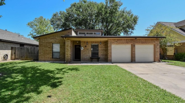 15 Murex St, Bay City, TX 77414 - view of front facade featuring a garage, brick siding, and concrete driveway
