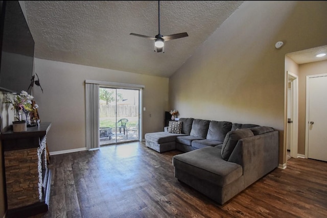 15 Murex St, Bay City, TX 77414 - living room with dark wood-type flooring, lofted ceiling, a ceiling fan, a textured ceiling, and baseboards