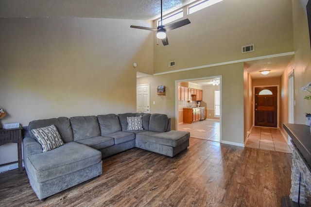 15 Murex St, Bay City, TX 77414 - living room with wood finished floors, a high ceiling, ceiling fan, and baseboards