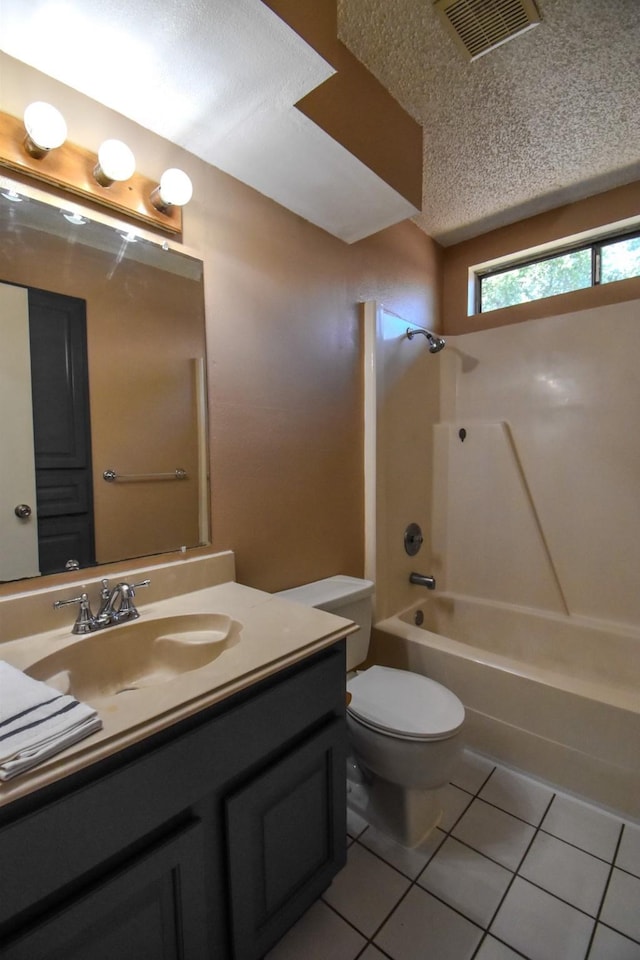 15 Murex St, Bay City, TX 77414 - bathroom featuring tile patterned flooring, shower / tub combination, toilet, vanity, and a textured ceiling