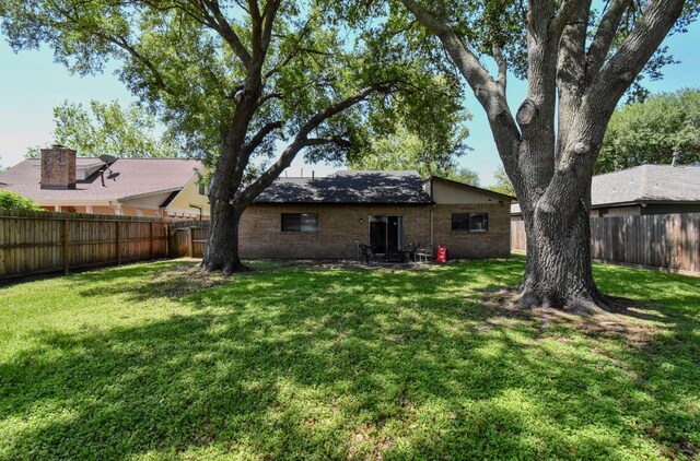 15 Murex St, Bay City, TX 77414 - rear view of house with brick siding