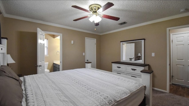 15 Murex St, Bay City, TX 77414 - bedroom featuring ornamental molding, a textured ceiling, baseboards, dark colored carpet, and ensuite bathroom