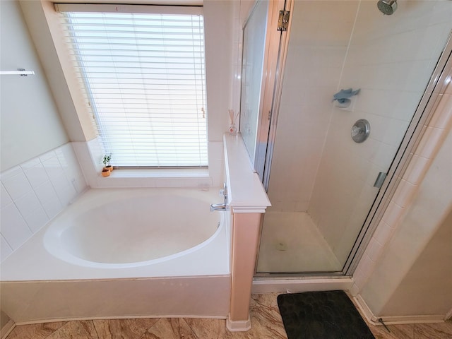 full bath with a garden tub and a shower stall