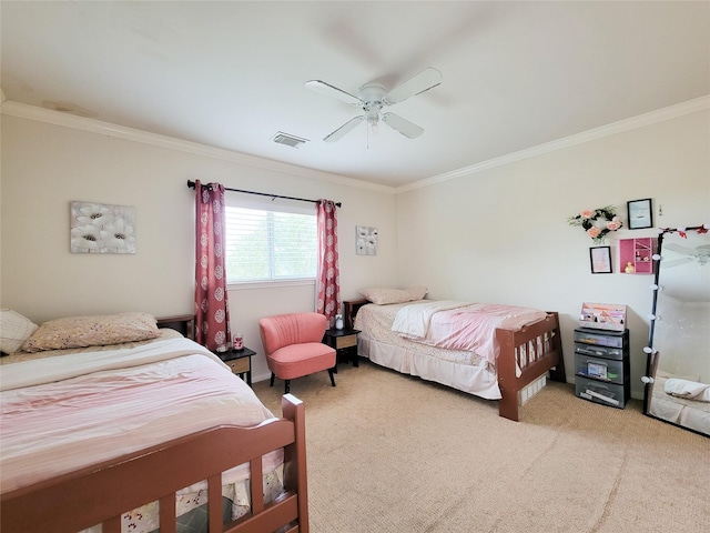 bedroom featuring ceiling fan, visible vents, light colored carpet, and crown molding