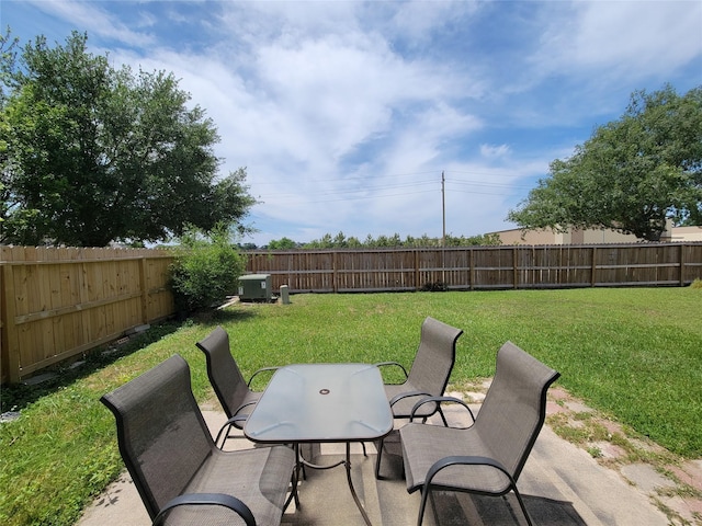 view of patio with a fenced backyard, central AC unit, and outdoor dining area