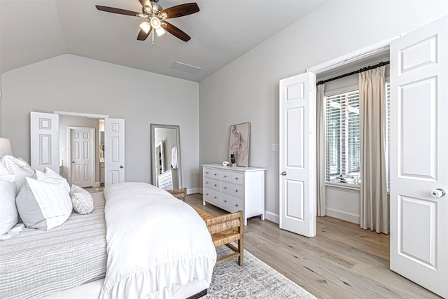 bedroom with vaulted ceiling, visible vents, light wood-type flooring, baseboards, and ceiling fan