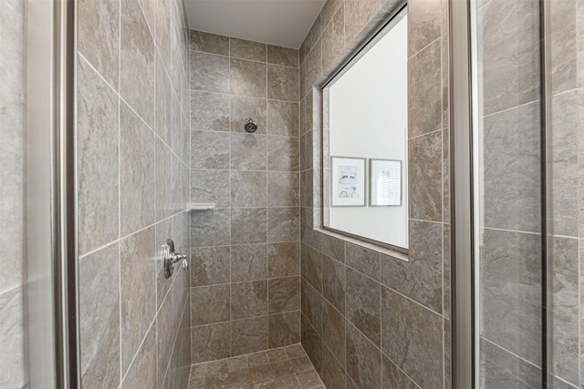 bathroom featuring a stall shower