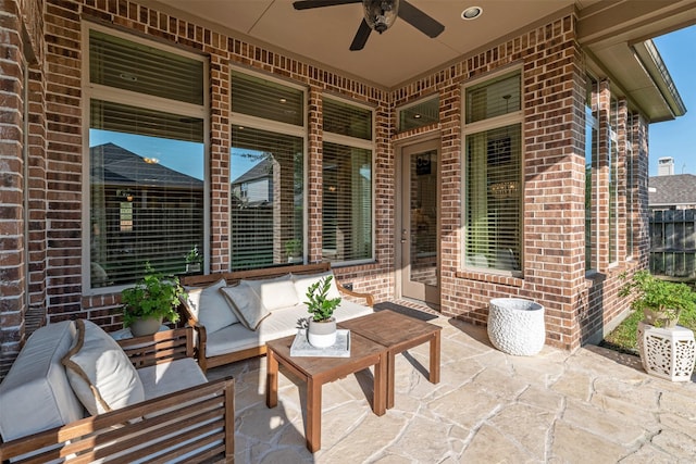 view of patio / terrace with an outdoor living space and a ceiling fan