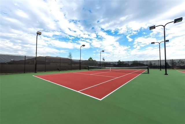 view of sport court featuring community basketball court and fence