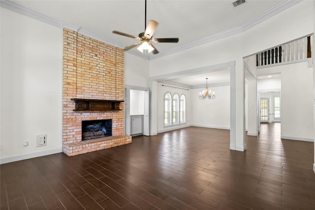 unfurnished living room featuring plenty of natural light, a fireplace, ceiling fan with notable chandelier, and crown molding