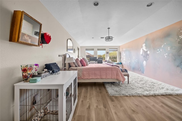 bedroom featuring wood finished floors