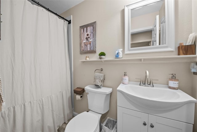 full bath featuring curtained shower, vanity, and toilet