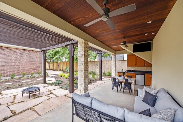 4404 Wendell St, Bellaire, TX 77401 - view of patio with an outdoor living space with a fire pit, a fenced backyard, outdoor dining area, a ceiling fan, and a pergola