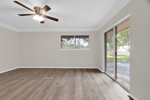 3142 La Quinta Dr, Missouri City, TX 77459 - unfurnished room featuring ornamental molding, baseboards, a healthy amount of sunlight, and light wood-type flooring
