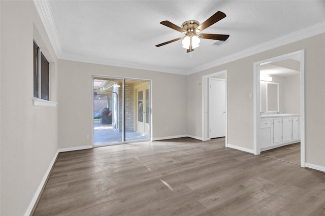 3142 La Quinta Dr, Missouri City, TX 77459 - unfurnished bedroom with crown molding, light wood-style flooring, baseboards, access to exterior, and visible vents