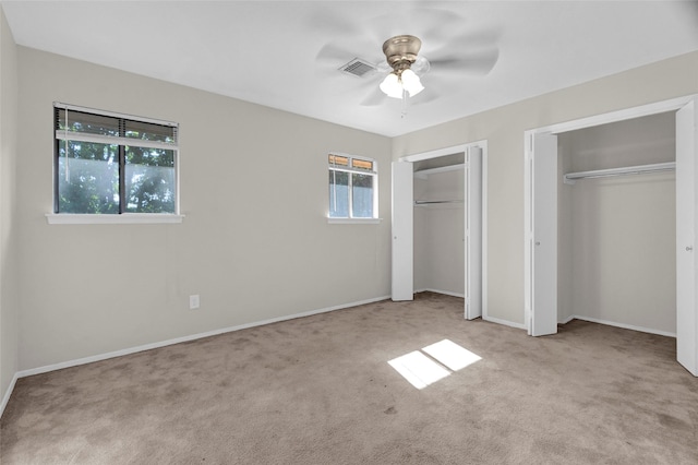 3142 La Quinta Dr, Missouri City, TX 77459 - unfurnished bedroom with carpet, multiple closets, baseboards, and visible vents