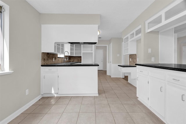 3142 La Quinta Dr, Missouri City, TX 77459 - kitchen with dark countertops, white cabinetry, decorative backsplash, open shelves, and light tile patterned floors