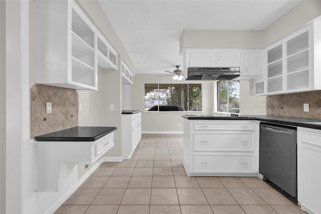 3142 La Quinta Dr, Missouri City, TX 77459 - kitchen featuring under cabinet range hood, dark countertops, dishwasher, light tile patterned flooring, and white cabinetry