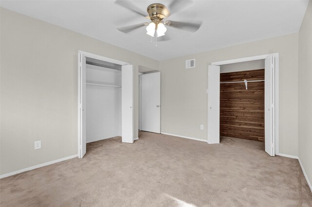 3142 La Quinta Dr, Missouri City, TX 77459 - unfurnished bedroom with two closets, light carpet, visible vents, and baseboards