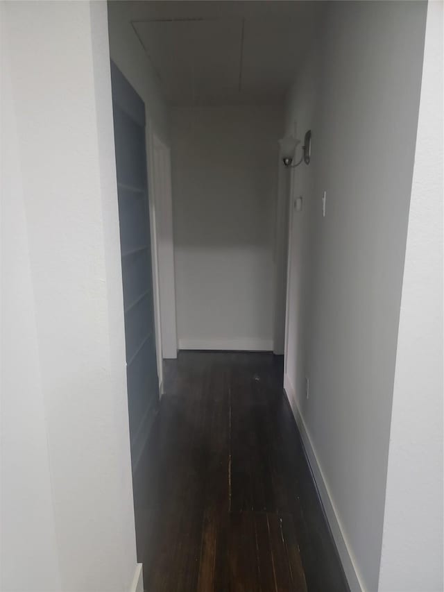 8424 Botany Ln, Houston, TX 77075 - corridor with attic access and dark wood finished floors