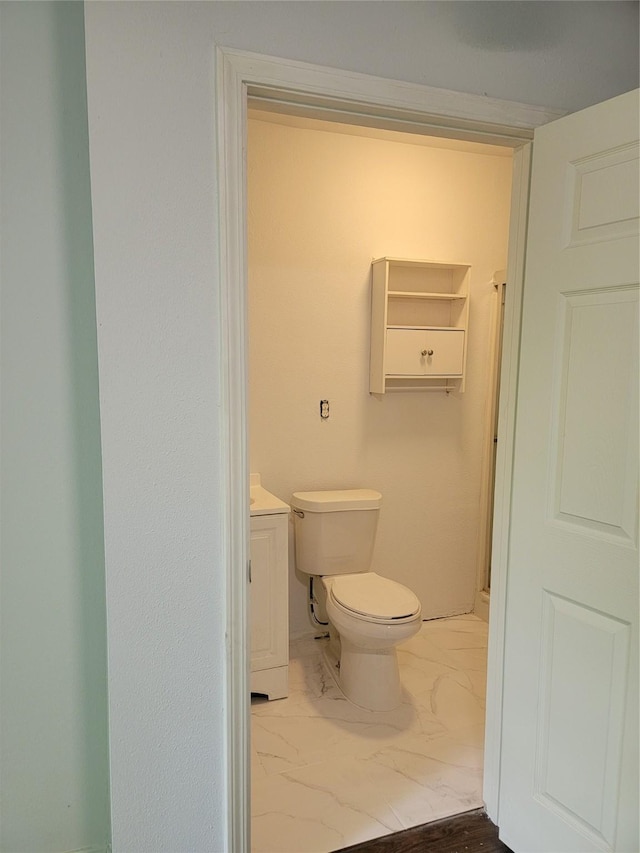 8424 Botany Ln, Houston, TX 77075 - bathroom with toilet, marble finish floor, and vanity
