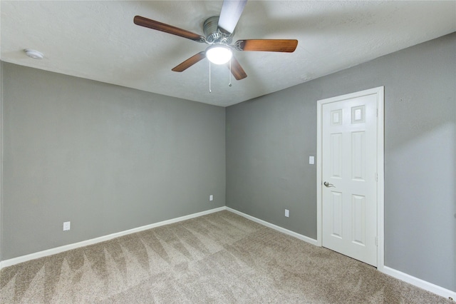 811 Strange Dr, Richmond, TX 77406 - spare room featuring baseboards, a ceiling fan, and carpet flooring
